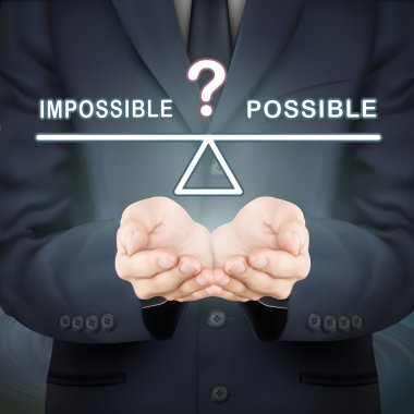 usinessman imkansız ve olası işareti arasında denge holding