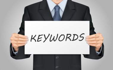 anahtar kelimeler poster tutan işadamı