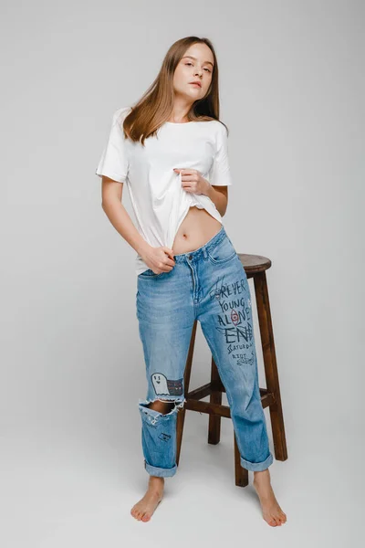 Model Tests Beautiful Girl Long Hair Stands Chair Posing — Stock Photo, Image