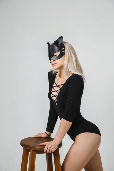 Cute Blonde Woman Leather Mask Black Bodysuit Stands Poses Studio — Stock Photo, Image