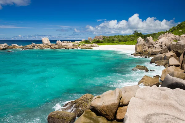 Seychelles island landscape, rocks, turquoise sea, clouds, blue sky. Royalty Free Stock Images