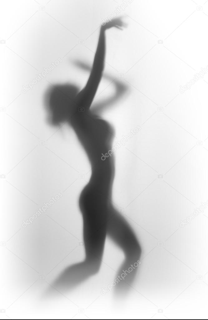 Silhouette of a beautiful slim dancing woman's body