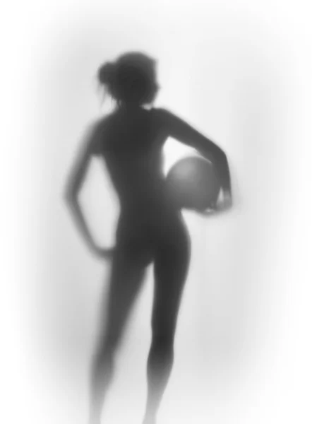 Beautiful sports woman body silhouette with ball — Stock Photo, Image