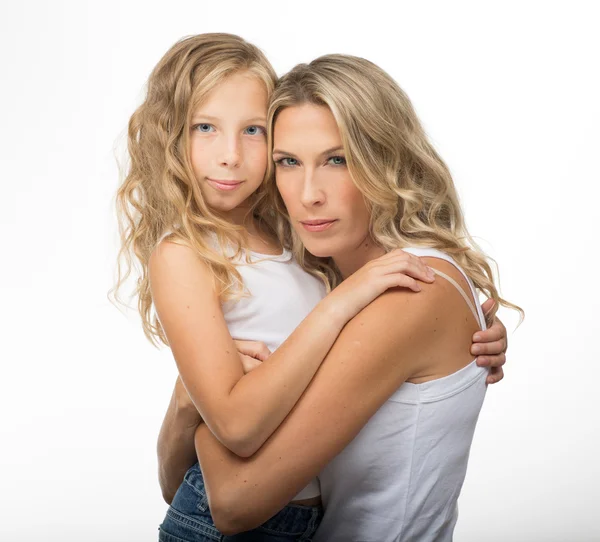 Beautiful blonde mother and daughter hugs each other — Stock Photo, Image