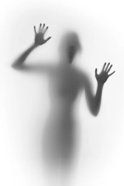 Shouting scary face and body silhouette behind a glass surface — Stock Photo, Image