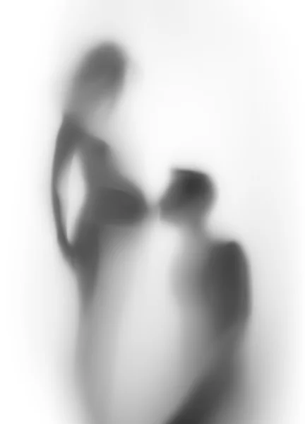 Zwangere vrouw en man samen, silhouet — Stockfoto