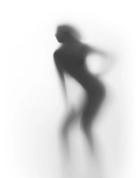 Mooie slanke vrouw silhouet achter een gordijn — Stockfoto
