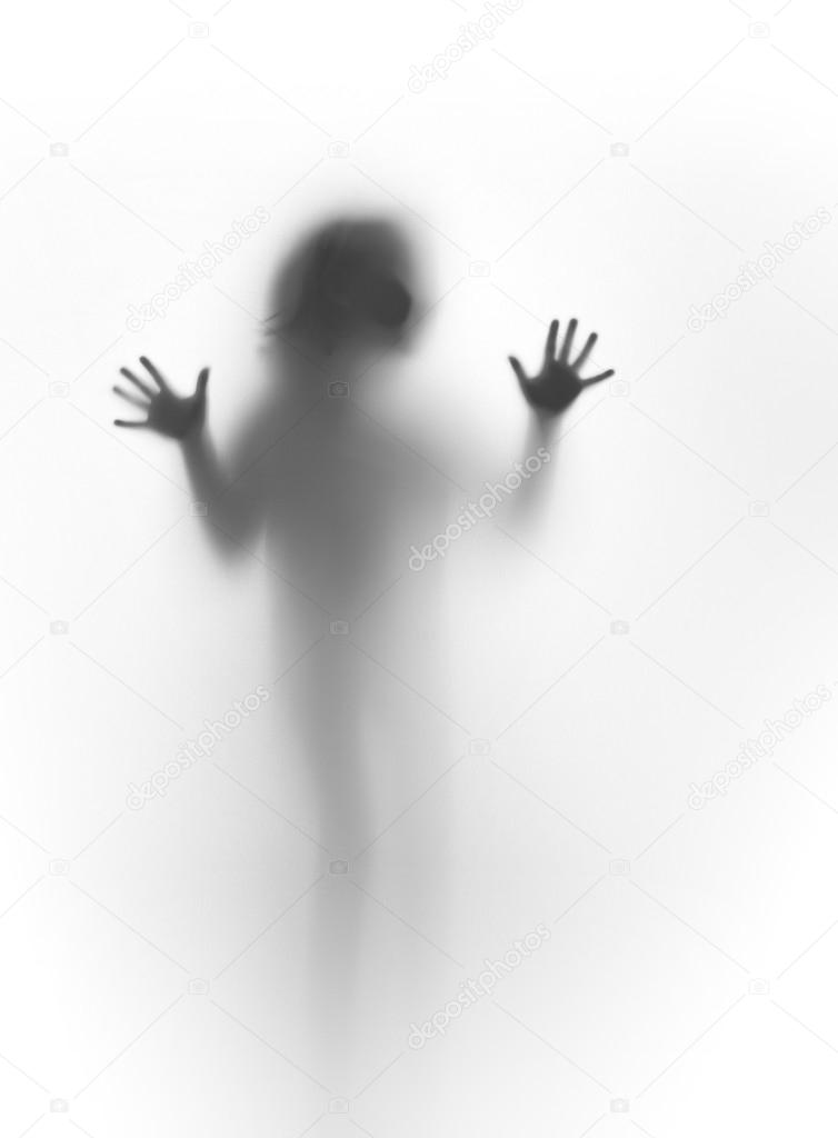 Silhouette of young child's body and hands