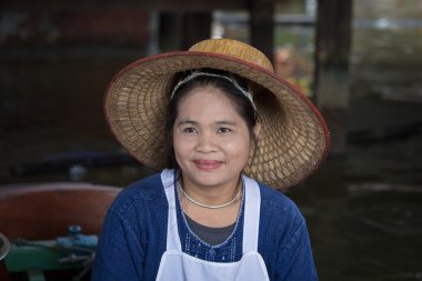 Portrait Thai woman in Taling Chan Floating Market. Bangkok, Thailand
