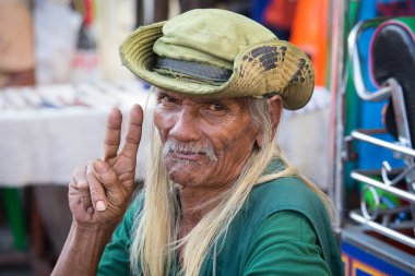 Thai man living in a poor district of Bangkok Klong Toe. Thailand clipart