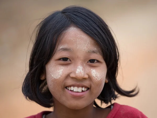 Portrait young girl with thanaka on her smile face. Myanmar — Stock Photo, Image