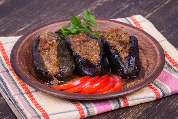 Baked eggplant stuffed with onions, cherry plums and walnuts — Stock Photo, Image