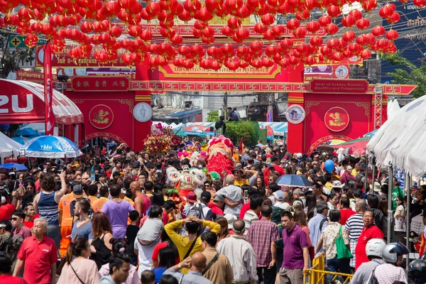 Crowd of people roams the street  Yaowarat during the celebration  Chinese New Year and Valentine's Day. Chinatown in Bangkok, Thailand