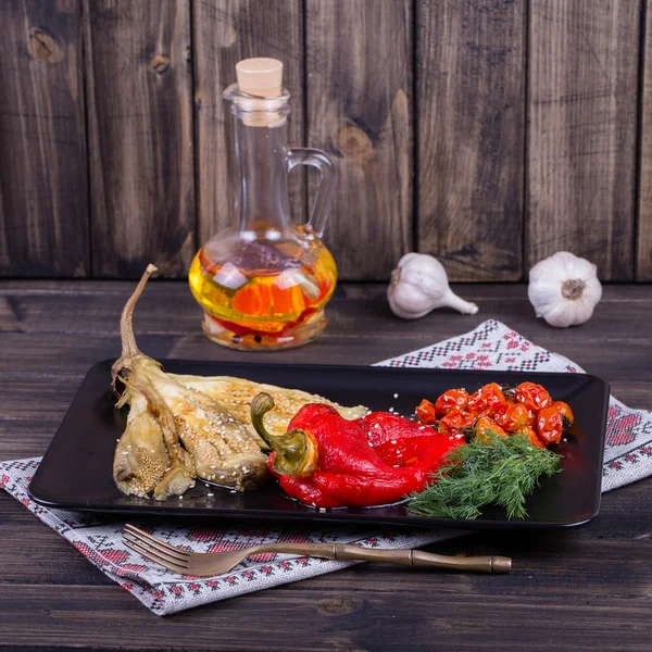 Roasted vegetables in black plate — Stock Photo, Image