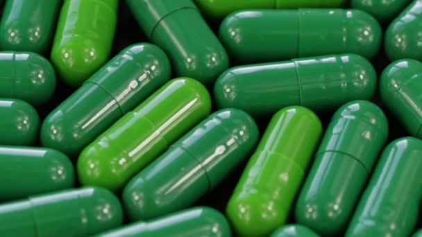 Grupo verde píldoras médicas, rotación, primer plano — Vídeos de Stock