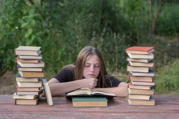 Young Girl Reading Book Dreams Garden Wooden Table Stack Books — Stock Photo, Image