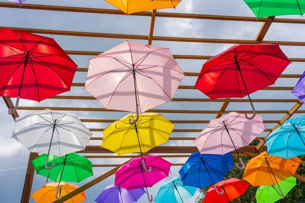 Street decorated with colored umbrellas, island Koh Phangan, Thailand. Hanging colorful umbrellas, on the outdoors