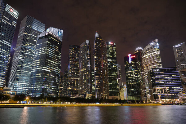 Singapore city, Singapore - march 27, 2019 : Singapore Skyline and view of skyscrapers on Marina Bay at night . Singapore cityscape of the financial district