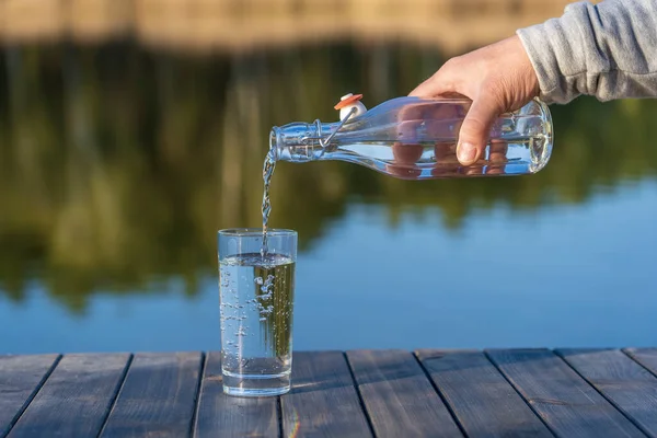 Pouring Drink Water Glass Bottle Morning Next Lake Forest Spring — Stock Photo, Image