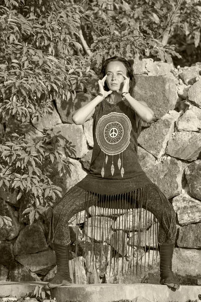 Young woman doing shamanic dance in nature.