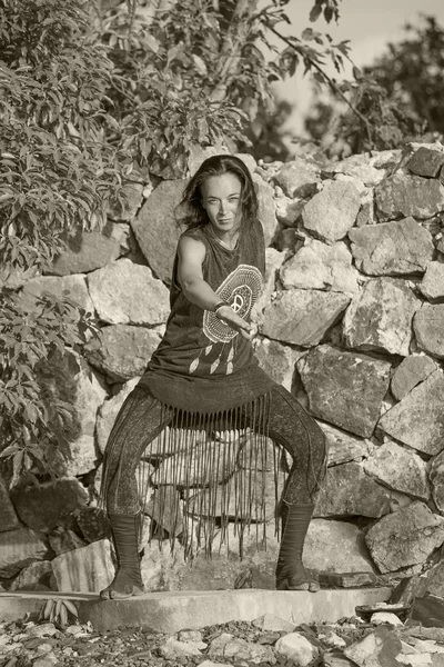 Young woman doing shamanic dance in nature.