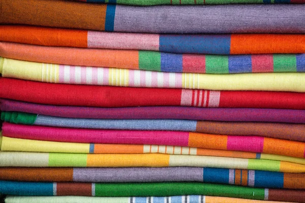 Heap of cloth fabrics at a local market in Sri Lanka. Close up . — Stock Photo, Image