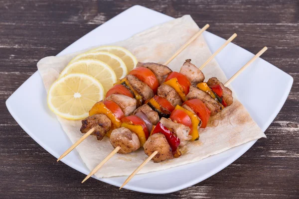 Grilled meat and vegetables on skewer — Stock Photo, Image