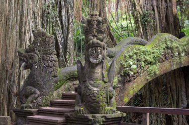 Famous dragon bridge in sacred monkey forest in Ubud, Bali, Indonesia. clipart