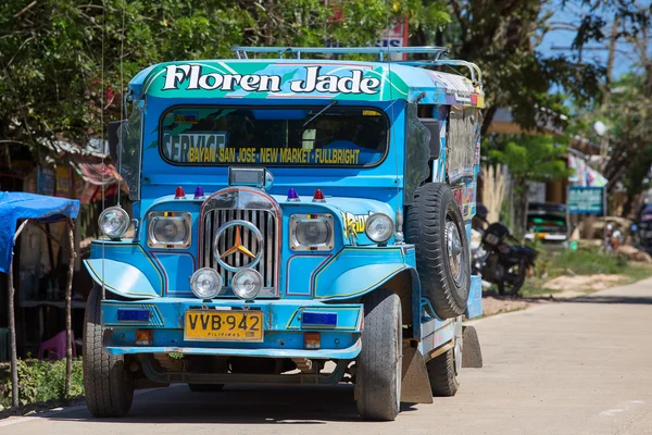 Jeepneys passing, Filipino inexpensive bus service. Philippines. — Stock Photo, Image