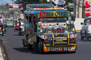 Jeepneys passing, Filipino inexpensive bus service. Philippines. clipart