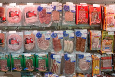 Cold Meat Ham Packs On Supermarket Stand.