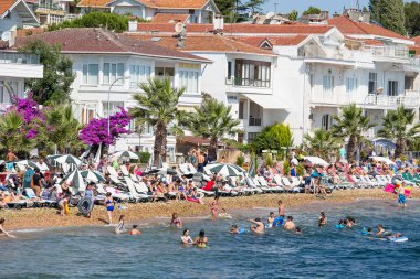 View of Princes Islands of Kinaliada hillside with luxury residential housing on coast, Turkey