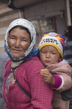 Portrait local woman with child on the street in Leh, Ladakh. India