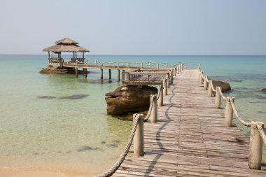 Tropical beach and quay pier in island Koh Kood , Thailand