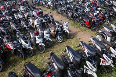 Motorbike parking on the street. Ubud, island Bali, Indonesia