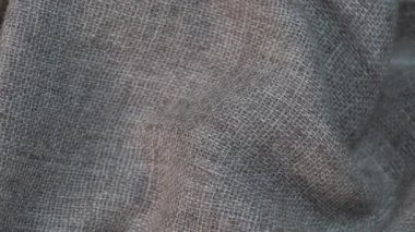 Arka plan olarak buruşmuş tekstil dokusu. Tasarım için doğal kumaş dokusu. Kapat, döndür