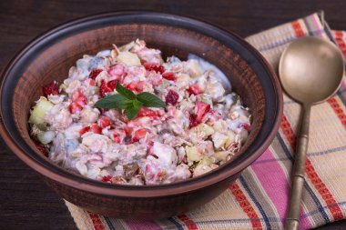 Muesli with lots of dry fruits, nuts, berries and grains in plate