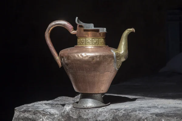 Old handmade tibetan pitcher on black background, India, Ladakh — 图库照片