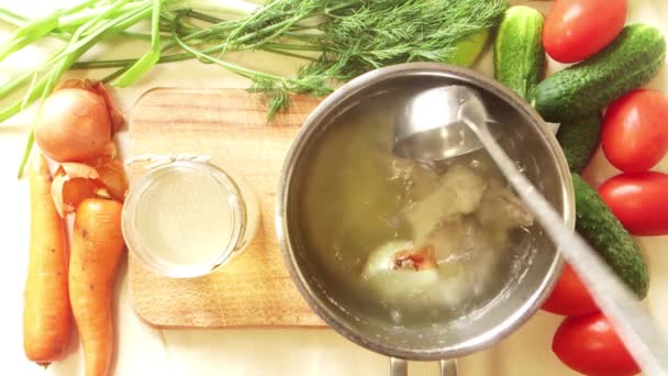 Man salt chicken broth in a saucepan — Stock Footage Man salt chicken broth in a saucepan Video Clip