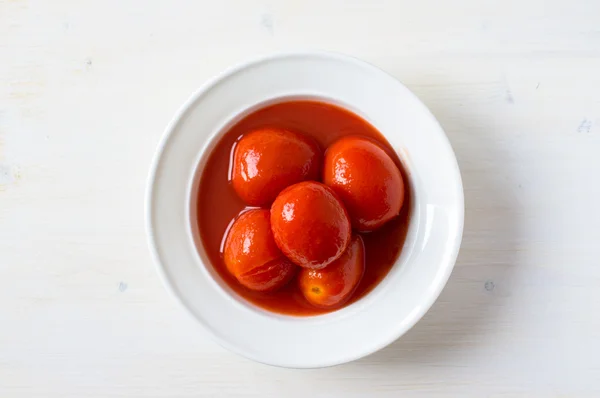 Tomatoes in juice — Stock Photo, Image