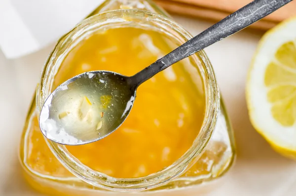 Lemon jam spoon on jar — Stock Photo, Image