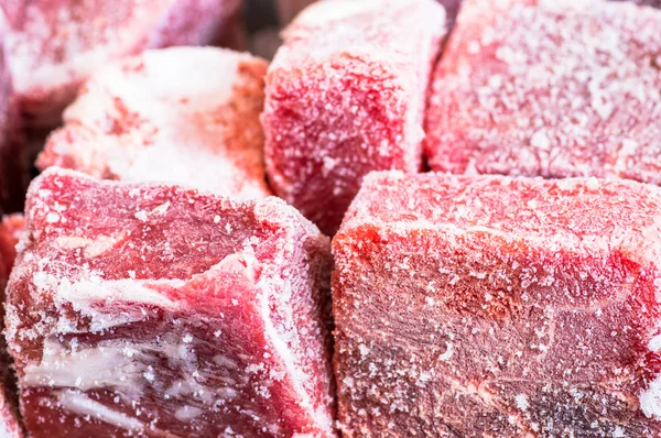 Hoarfrost on frozen pieces of meat — Stock Photo, Image