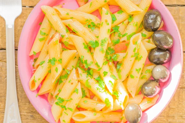 Penne pasta in tomato sauce in a plate — Stock Photo, Image