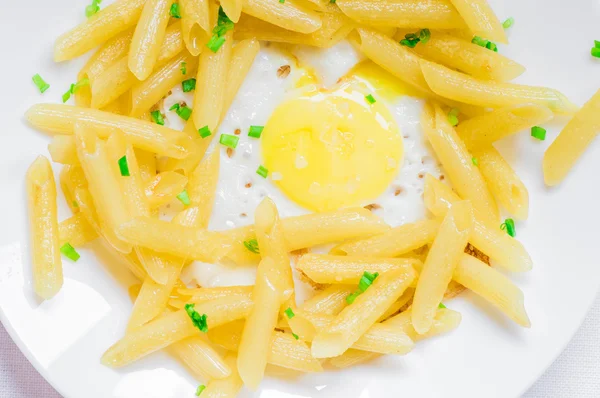 Fried eggs with pasta — Stock Photo, Image