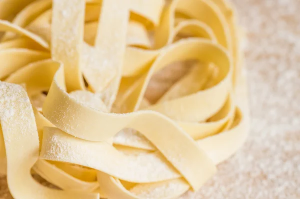 Pasta fettuccine dry on the table — Stock Photo, Image