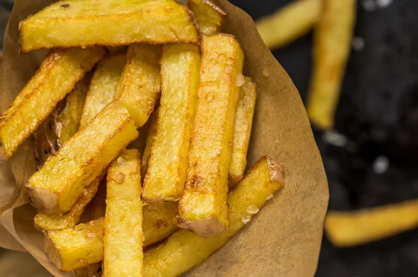 Paper with French fries — Stock Photo, Image