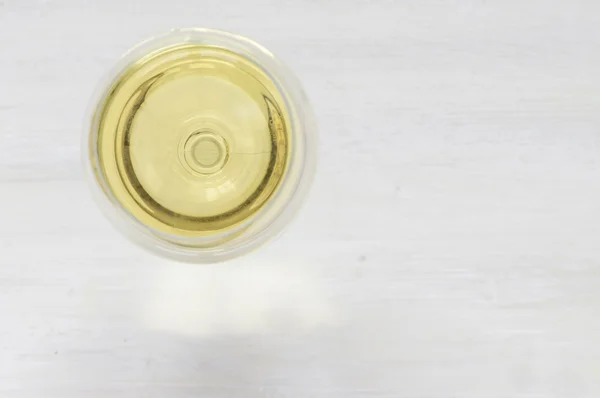 White wine glass on a white background