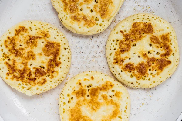 Pancakes are fried in a pan — Stock Photo, Image