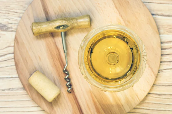 Glass of white wine on wooden board — Stock Photo, Image