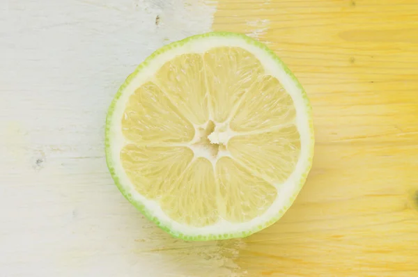 Lemon yellow on a blue background — Stock Photo, Image